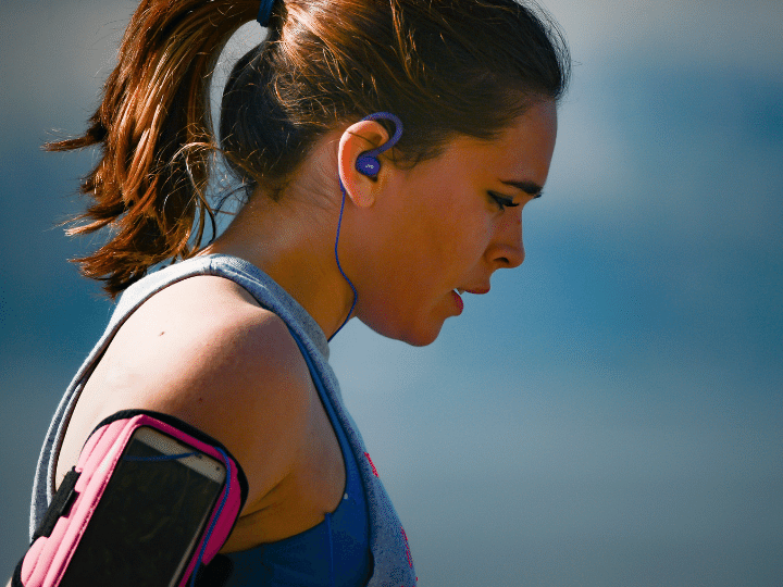 woman exercising with music